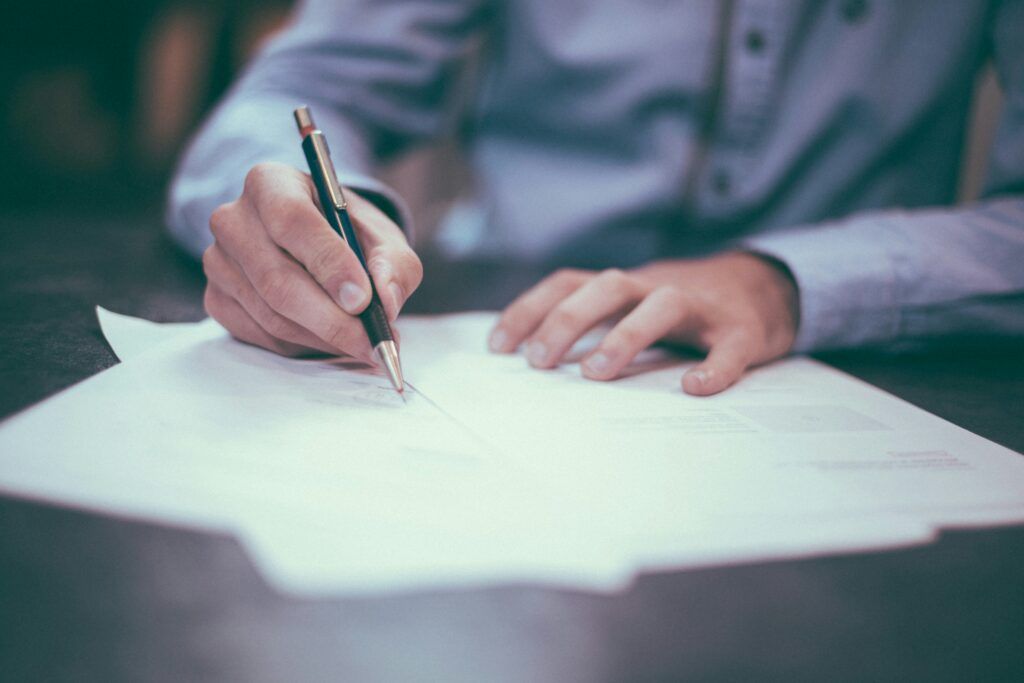 a Chester County motorcycle accident lawyer signing legal documents