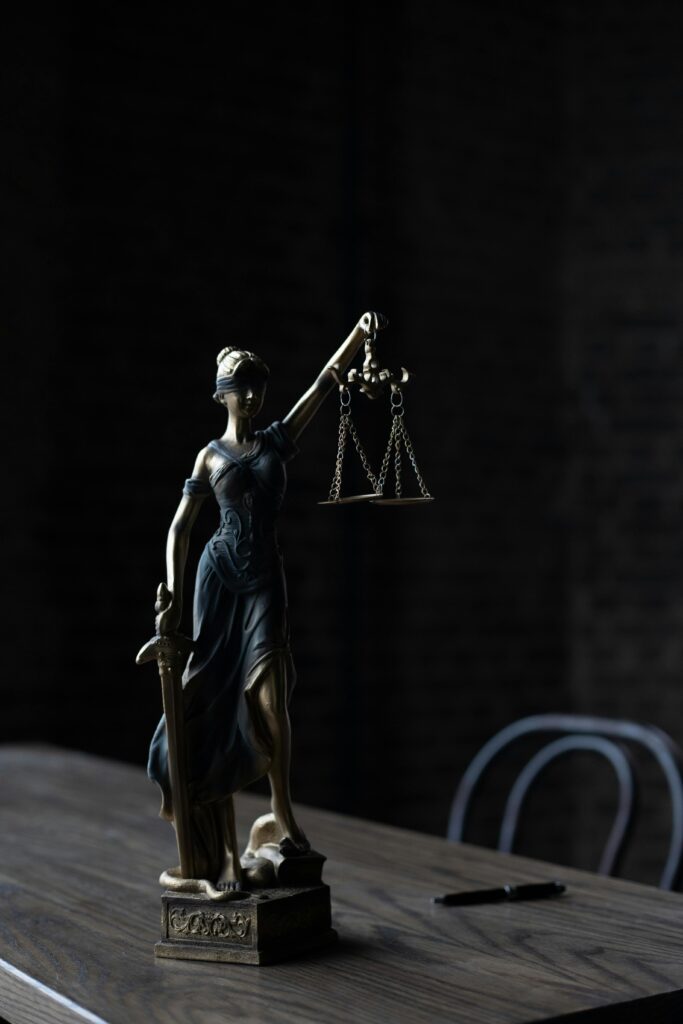 a closeup of a lady justice statue on a desk in a West Chester, PA medical malpractice attorney's office