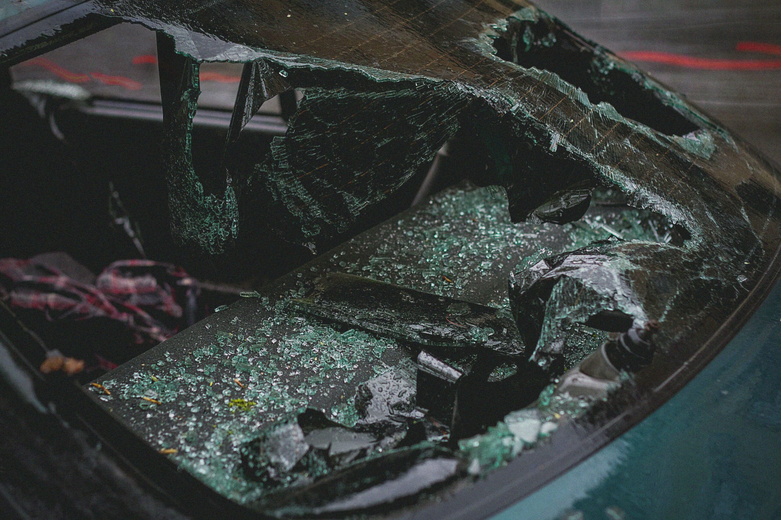 a closeup of a broken windshield after a West Chester car accident