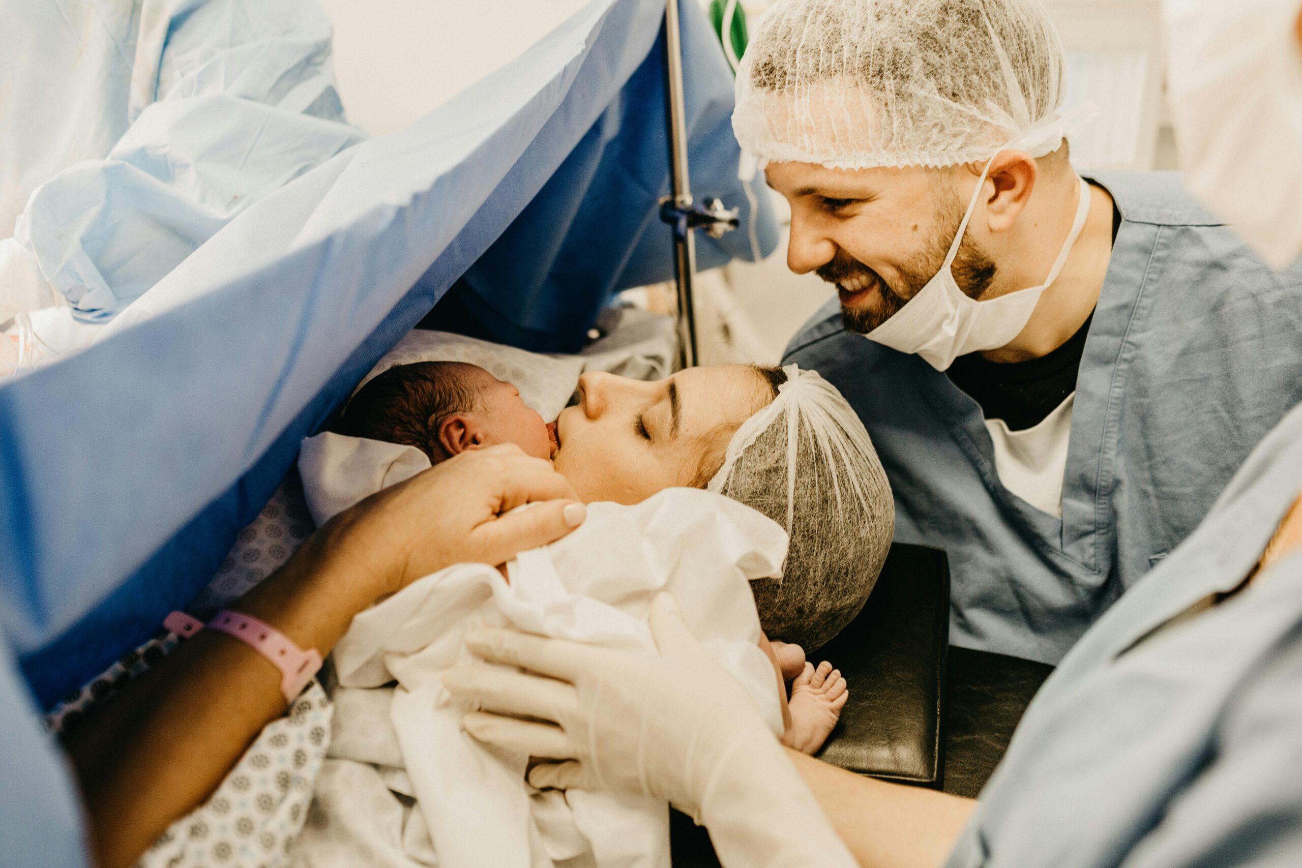 parents with their newborn baby at a hospital shortly after birth