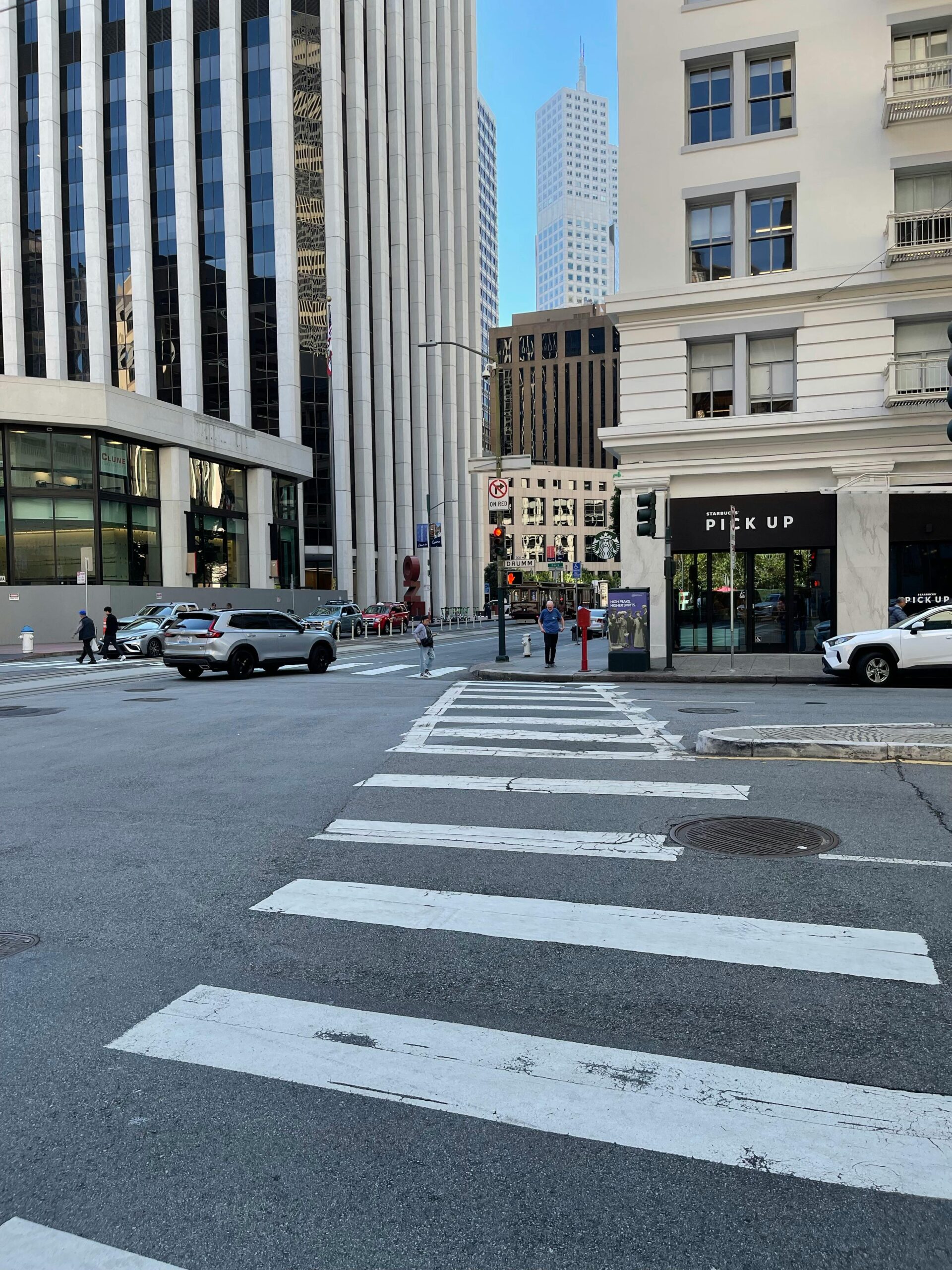 a crosswalk in a busy city
