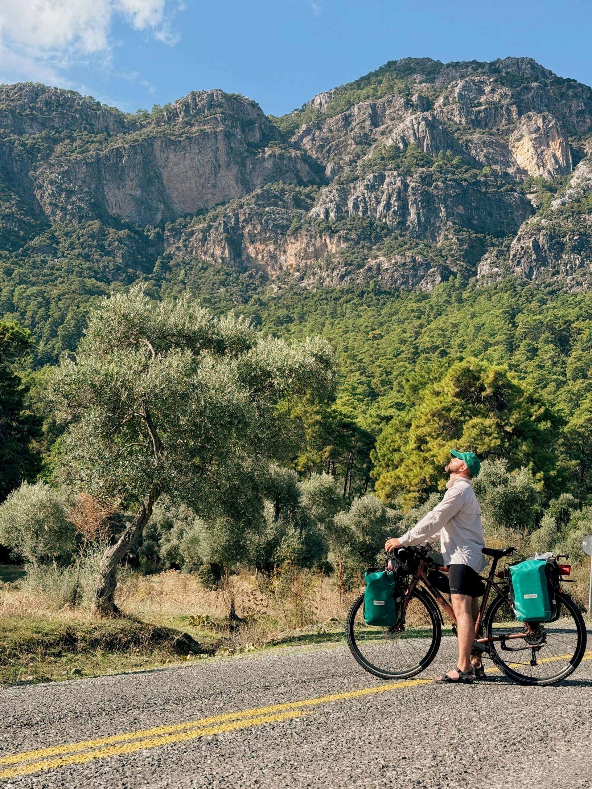A cyclist riding their bike in the middle of a road