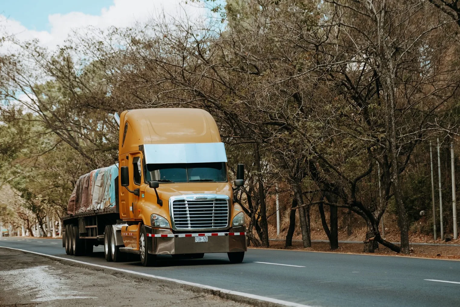 A commercial truck driving down the road.