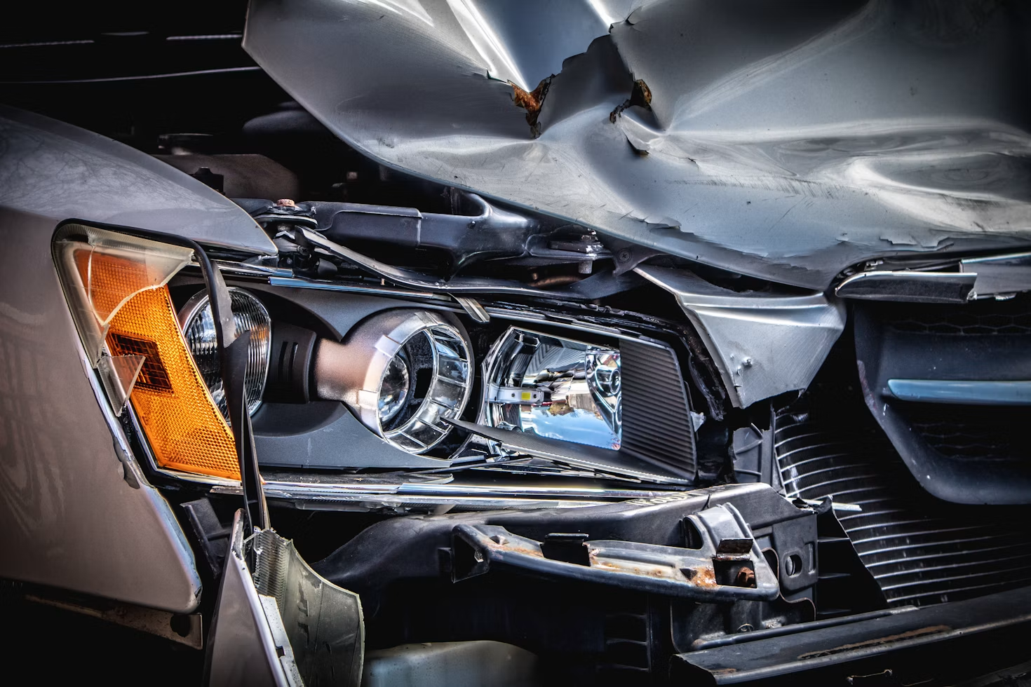 Close up image of a damaged car bumper after an accident.
